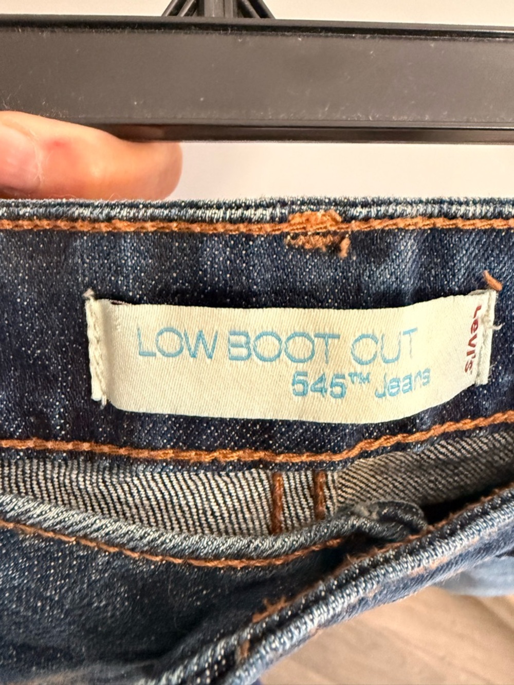 Levi's dark blue denim low boot cut jeans with orange stitching